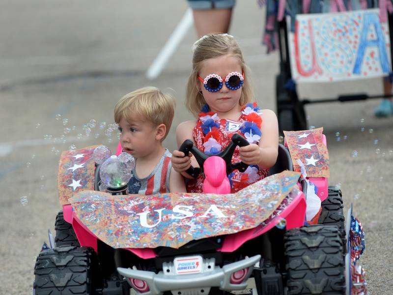 Kids show their rides and patriotic colors at Let Freedom Ring Kiddie Parade
