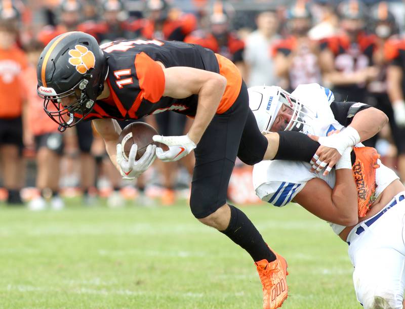 Crystal Lake Central’s Thomas Hammond runs the ball against Burlington Central in varsity football at Crystal Lake Saturday.