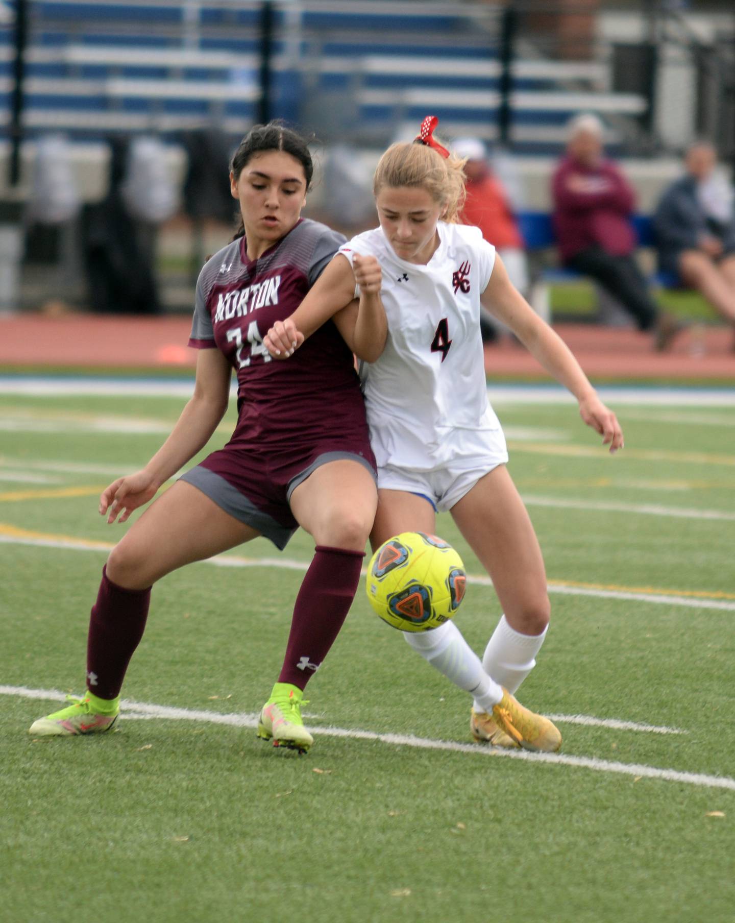 Morton West's Aaliyah Leanos competes for the ball against Hinsdale Central's Carter Knotts during the regional final game held Saturday May 21, 2022.