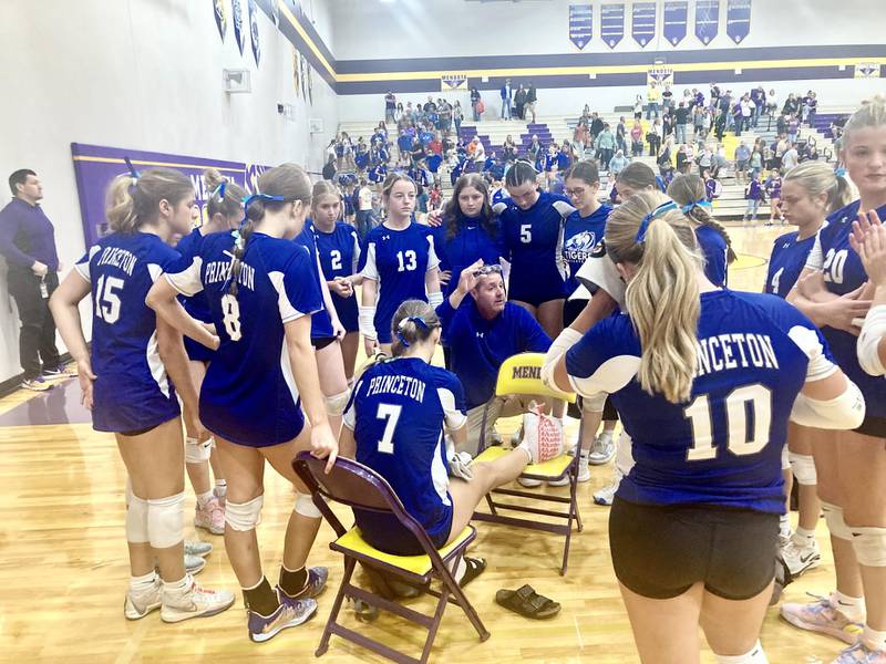 Princeton coach Andy Puck and the Tigresses huddle around injured teammate Kathy Maciczak after Tuesday's victory over the host Spikers at Mendota.