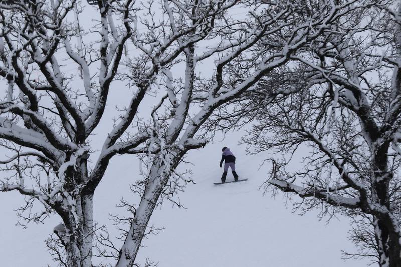 A snowboard comes down the hill at Wilmot Mountain on Thursday, Jan. 18, 2024.