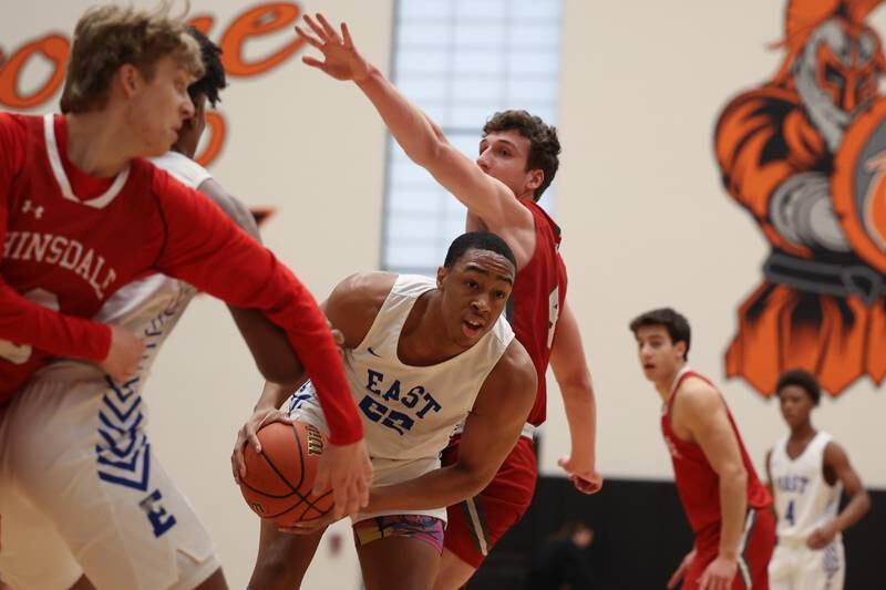 Lincoln-Way East’s Kyle Olagbegi ducks under the defense en route to the basket against Hinsdale Central in the Lincoln-Way West Warrior Showdown on Saturday January 28th, 2023.