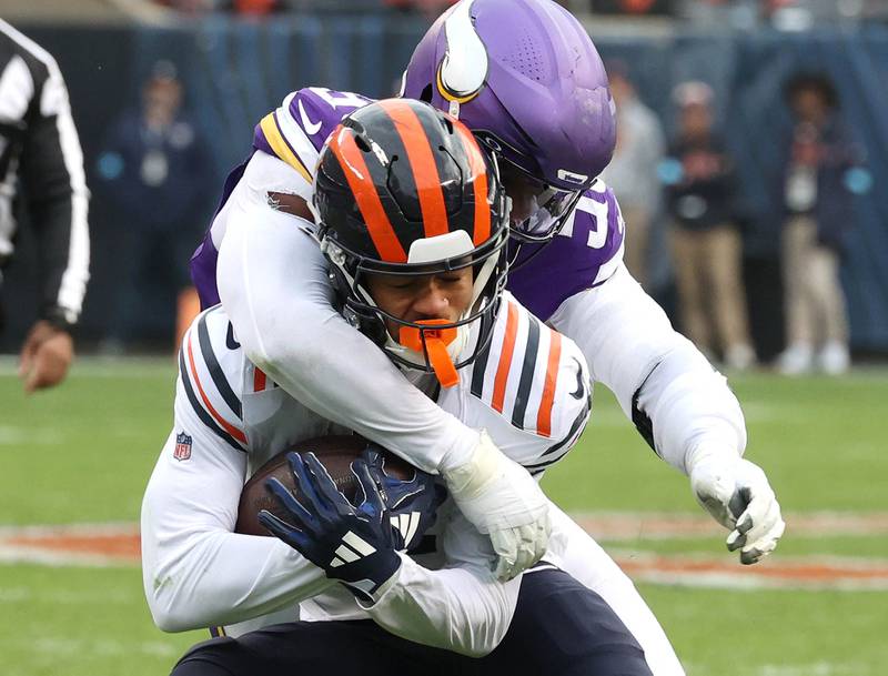 Chicago Bears wide receiver Rome Odunze is tackled by Minnesota Vikings linebacker Jonathan Greenard during their game Sunday, Nov. 24, 2024, at Soldier Field in Chicago.