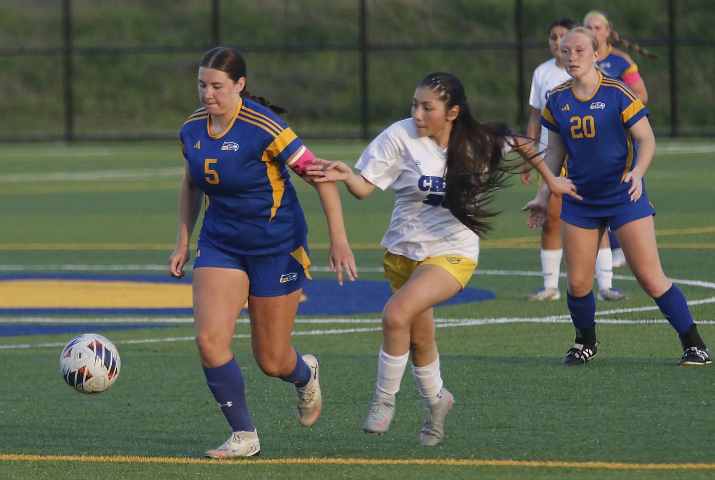 Johnsburg's Elaina Moss tries to get away from the defense of Cristo Rey St. Martin's Zaory Munoz during an IHSA Class 1A Cristo Rey St. Martin Sectional semifinal girls soccer match on Tuesday, May 26, 2026 at Cristo Rey St. Martin College Prep, in Waukegan.
