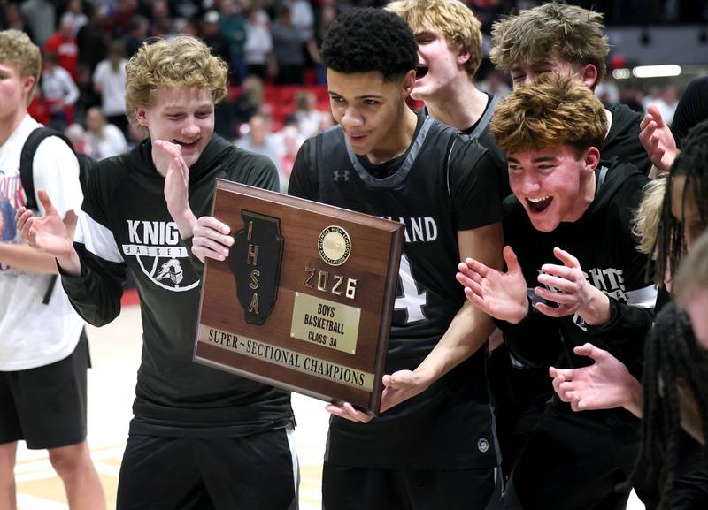 Kaneland players celebrate their win over Morton Monday, March 9, 2026, after their IHSA Class 3A supersectional matchup in the Convocation Center at Northern Illinois University in DeKalb.