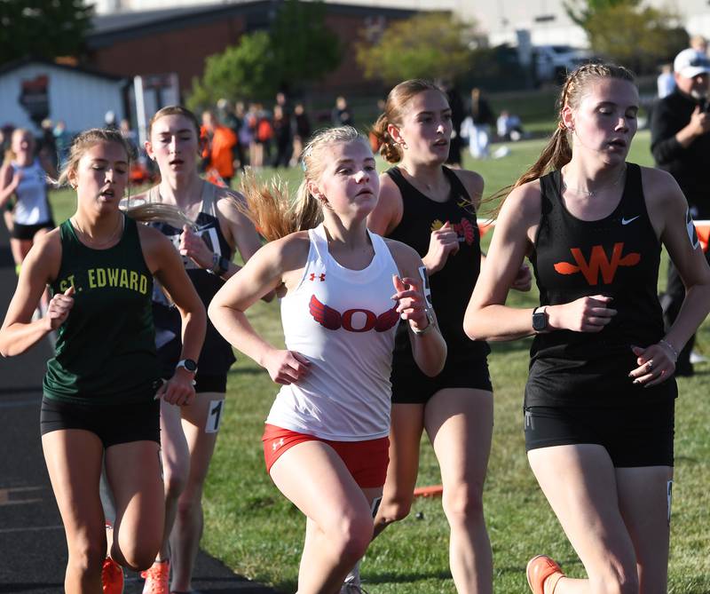 Oregon's Madeline Rogers (center) runs one of the curves en route to a first place finish in the 3200 meter run at the 1A Winnebago Sectional on Wednesday, May 13, 2026.