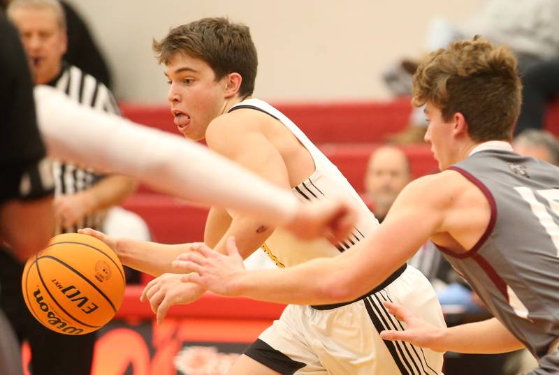 Putnam County's Johnathon Stunkel runs by Illinois Valley Central's Bryce Ratcliff during the 50th annual Colmone Classic on Thursday, Dec. 12, 2024 at Hall High School.