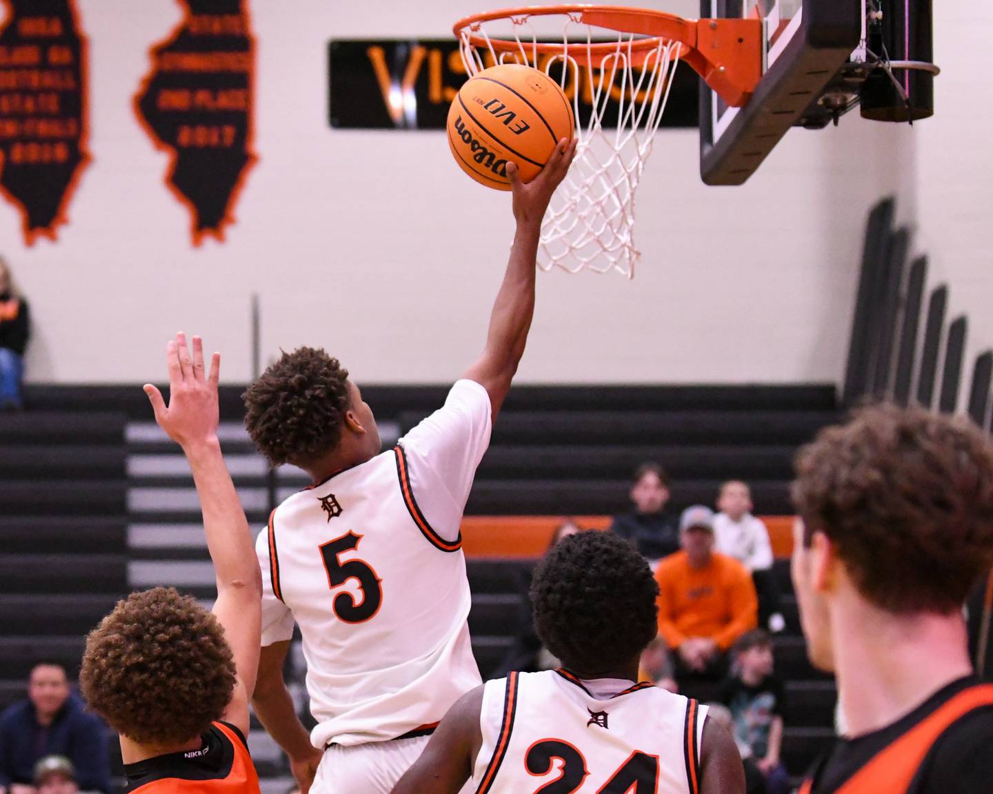DeKalb's Bryan Miller (5) makes a basket during the third place Dayton Tournament game on Tuesday Dec. 30, 2025, while taking on United Township held at DeKalb High School.