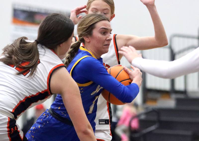 Johnsburg’s Ava Jablonski navigates heavy traffic in varsity girls basketball on Saturday, Jan. 4, 2025, at McHenry High School in McHenry.