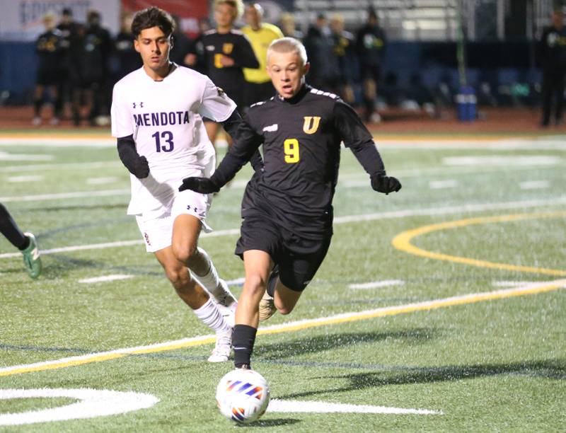 Normal U-High's Jaxen Maubach beats out Mendota's Sebastian Carlos to the ball during the Class 1A State semifinal game on Thursday, Nov. 7, 2024 at Hoffman Estates High School.