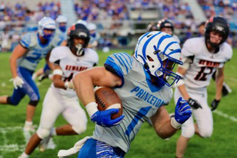 Princeton's Casey Etheridge races for a big gain against Kewanee Friday night at Bryant Field. He rushed for 130 yards and four touchdowns on just  six carries to lead the Tigers to a 63-12 victory.