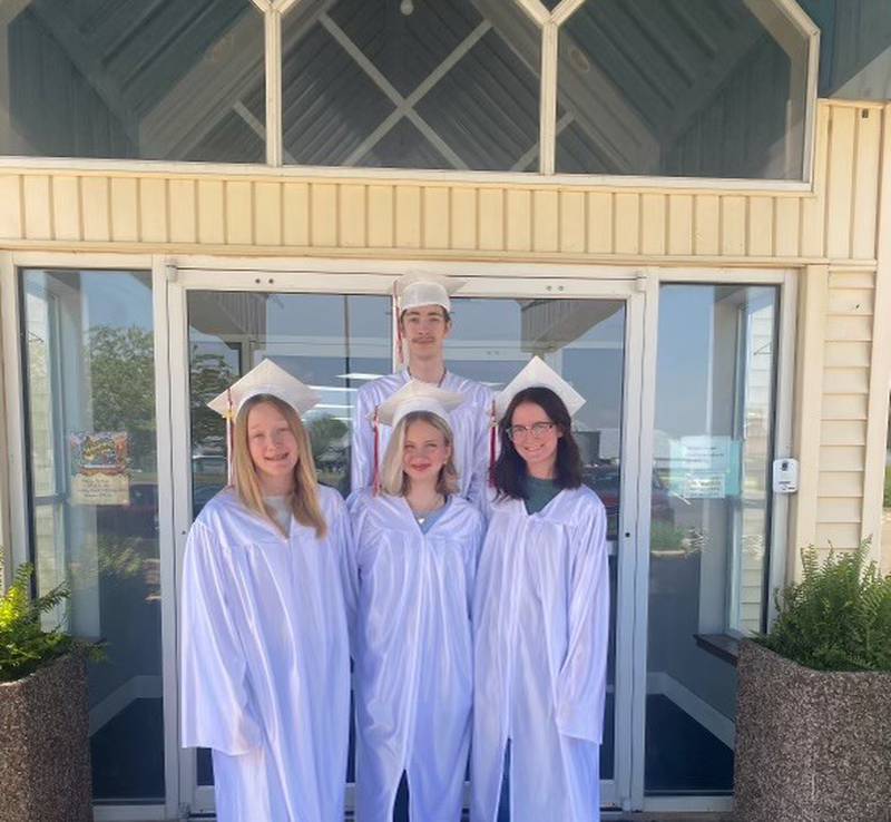 Princeton Christian Academy had four graduates in the class of 2025 - Brylee Campbell (left), Brooke Clausen, Ava Claussen and Josiah Gale (back).
