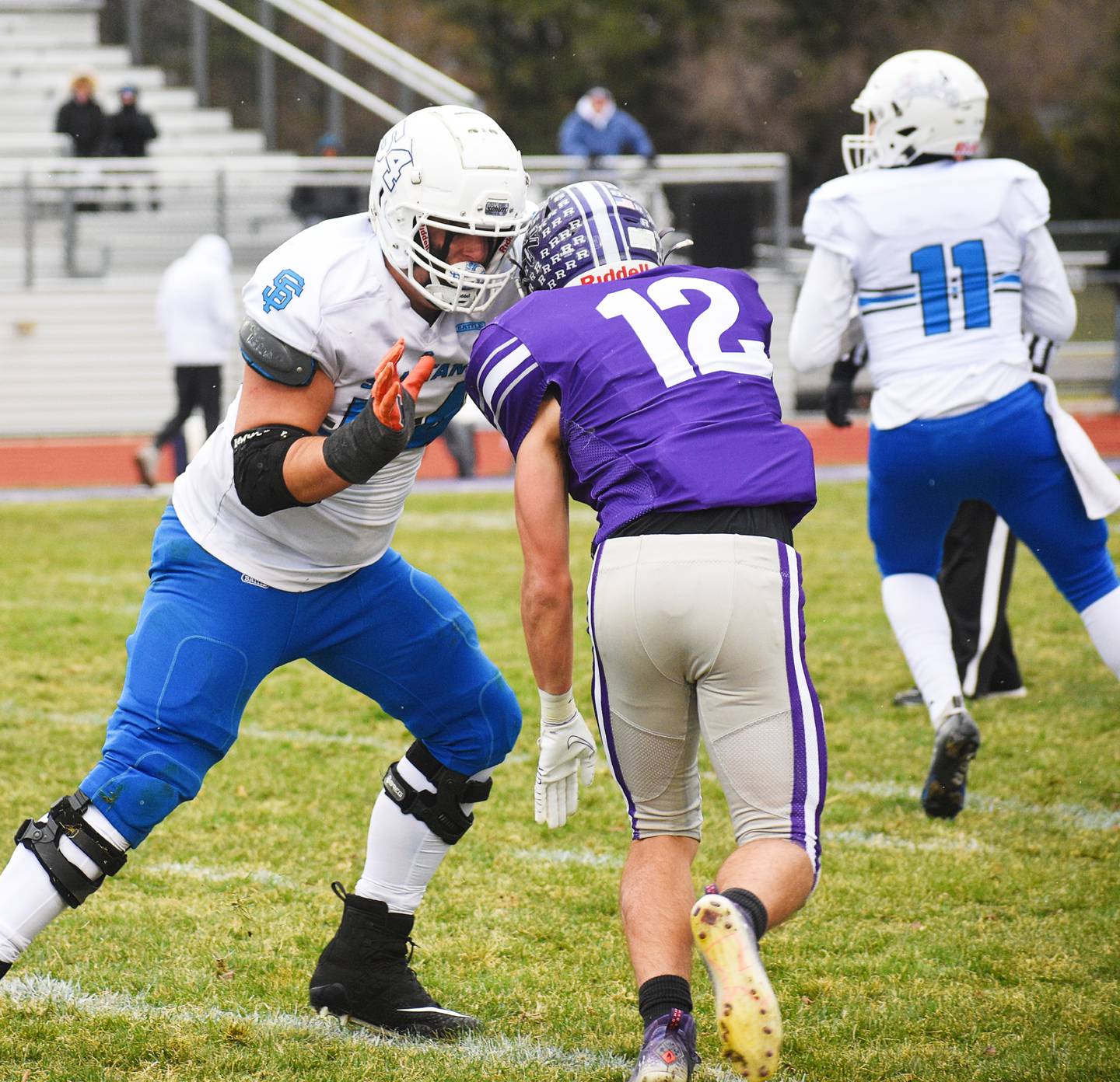 Wheaton St. Francis offensive tackle TJ McMillen blocks Rochelle defensive end Jack Pavlak during Saturday’s Class 4A state quarterfinal game in Rochelle.