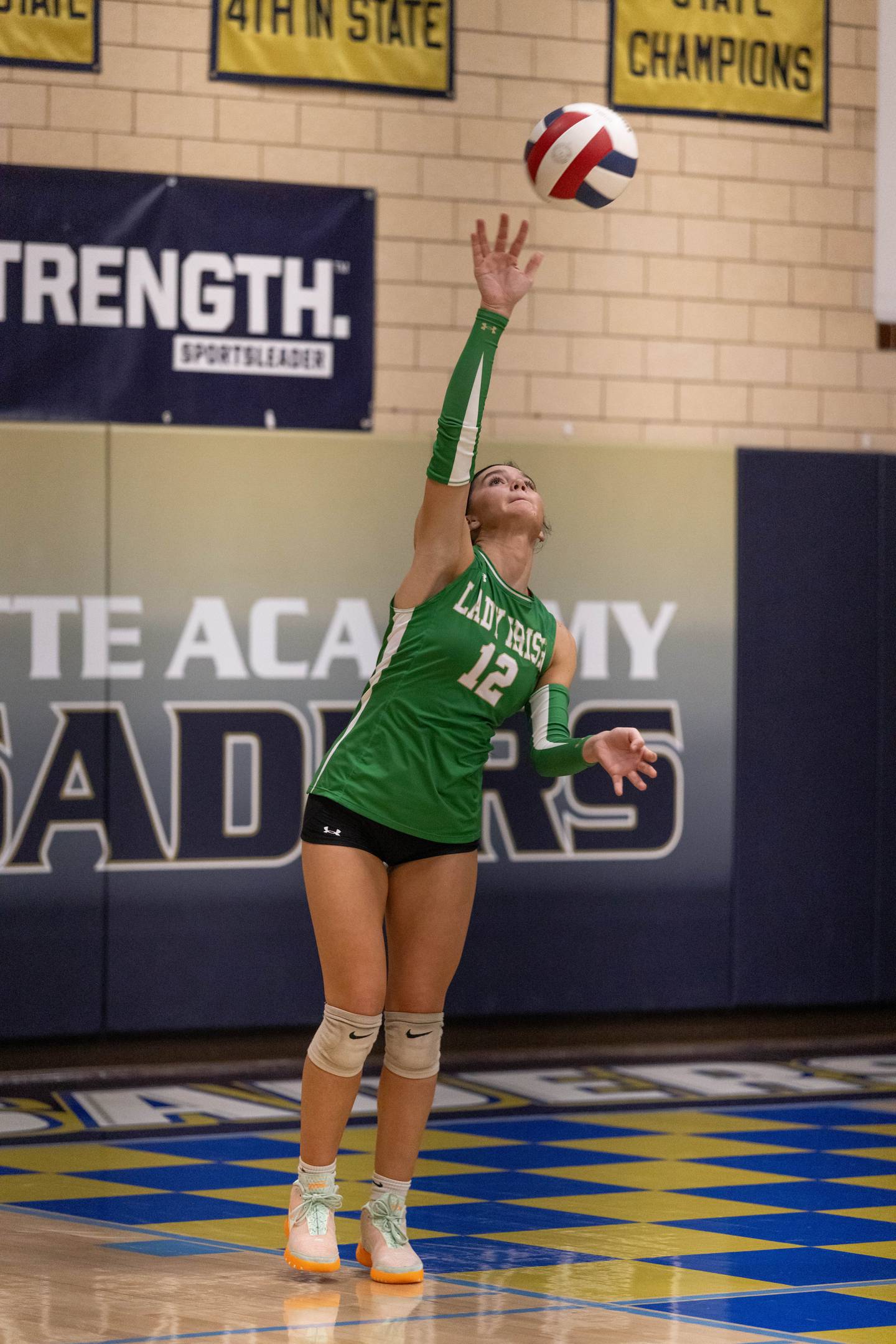 Seneca High Schools Lexie Buis serves the ball during the match against Marquette at Bader Gym on September 25, 2025 at Marquette High School.