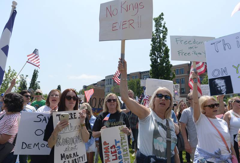 People including Lori Halpin of Westchester chant "No Kings" while participating in the nationwide No Kings Day Rally in Elmhurst Saturday June 14, 2025. Speakers including DuPage County Recorder Liz Chaplin and County Board Member Andrew Honig show support during the rally.