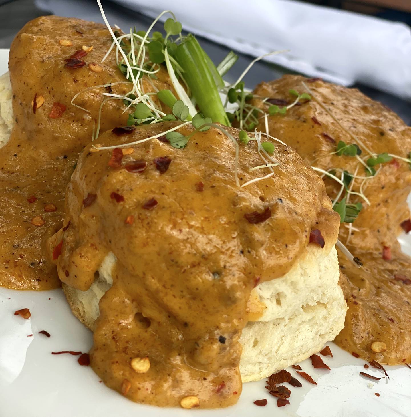 The biscuits and gravy at Launch Kitchen are served with a red gravy and chorizo.