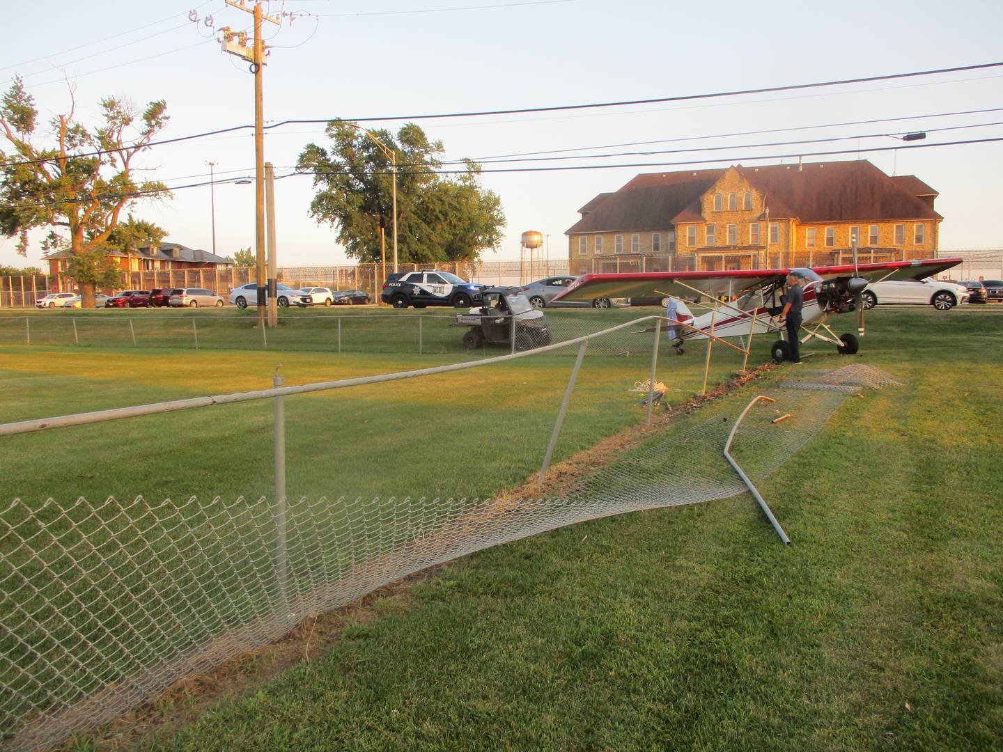 A torn chain link fence was the only damage after a pilot made an emergency landing of a plane on the edge of the Inwood Golf Course in Joliet. Aug. 14, 2025