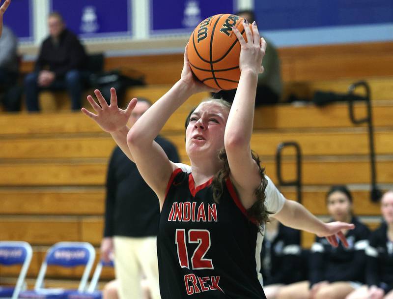 Indian Creek's Bethany Odle shoots in front of Hinckley-Big Rock's Grace Hall during their game Thursday, Jan. 29, 2026, at Hinckley-Big Rock High School.