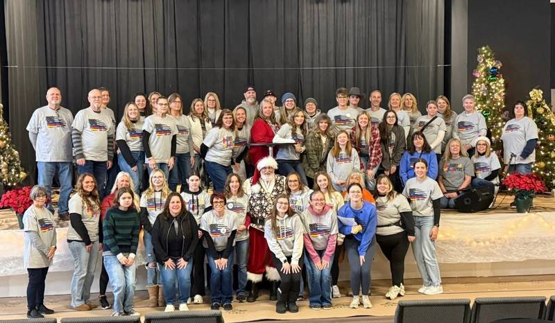 The volunteers who make Grundy County Heroes & Helpers possible with Santa Claus during last year's An Evening with Santa Claus event.
