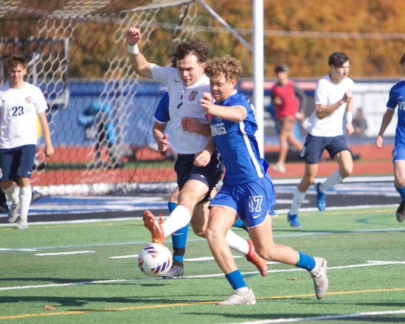 Conant's Krystian Niziolek battles for the ball with Geneva's Benjamin Murphy at the Class 3A St. Charles North Sectional Final on Saturday, Nov.2,2024 in St. Charles.