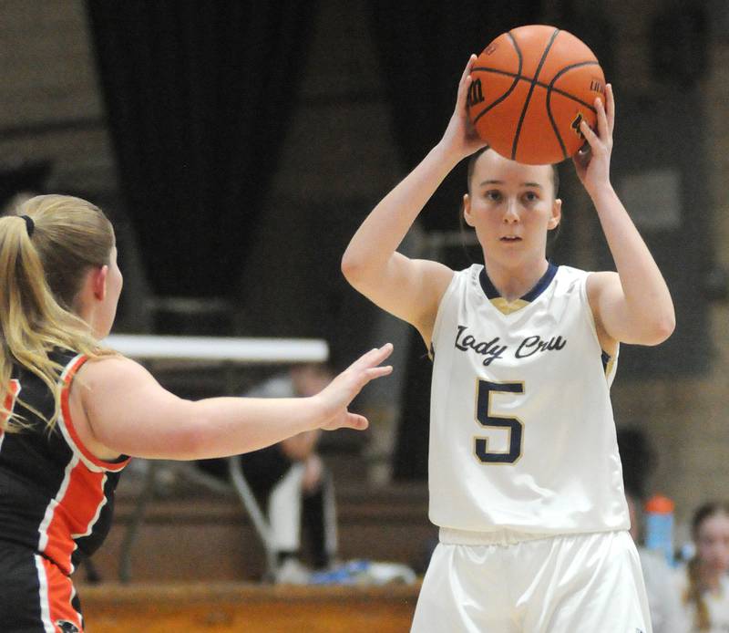 Marquette's Chloe Larson looks to pass as Gardner-South Wilmington's Aspen Lardi defends at Bader Gym on Saturday, Feb. 10, 2024.
