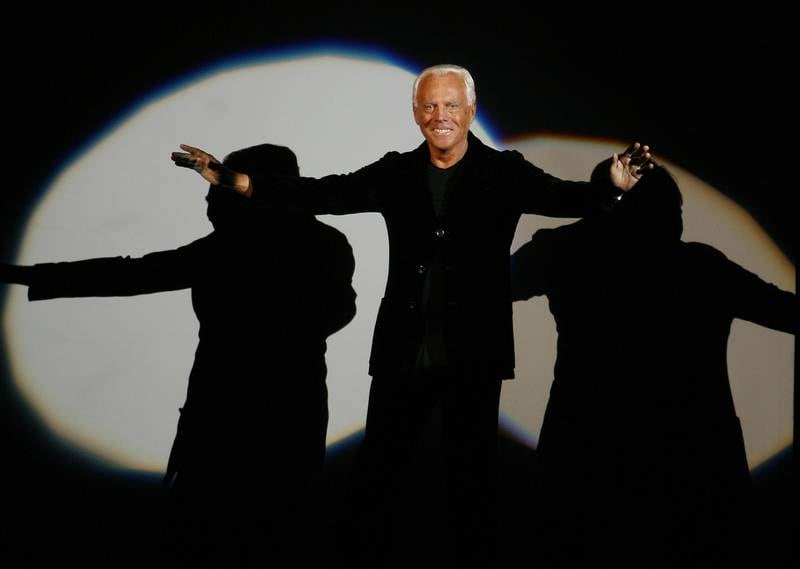 FILE - Giorgio Armani receives his share of applause after presenting his Emporio Fall-Winter 2007-2008 men's fashion collection, during the Milan Men's Fashion Week, in Milan, Italy, Monday, Jan. 15, 2007.