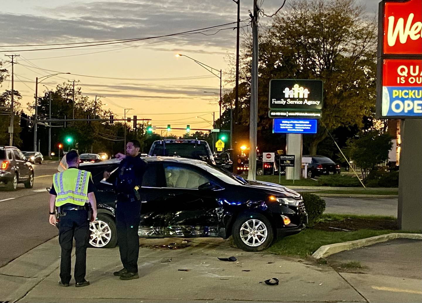 DeKalb police shown at about 6:30 p.m. Monday, Oct. 7, 2024, responding to a flipped black SUV in the parking lot of Wendy's fast food restaurant, 1321 Sycamore Road, DeKalb. One person suffered injuries in the crash.