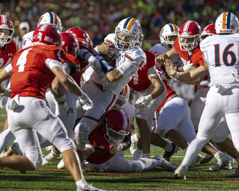 Oswego's Teddy Manikas (1) reaches out just short of the endzone during football game between Oswego at Naperville Central  on Friday, Aug 29, 2025  in Naperville.