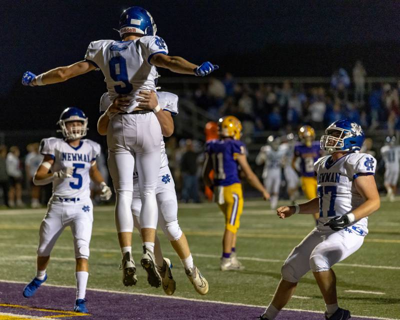 Newman Central Catholic High School's Asher Ernst leaps up into a team mates arms to celebrate his touchdown against Mendota during the game at The Jeff Prusator Athletic Complex on September 5, 2025 at Mendota High School.