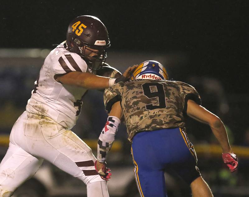 Richmond-Burton's Braxtin Nellessen tries to run through Johnsburg's Landon Johnson during a Kishwaukee River Conference football game on Friday, Oct.6, 2023, at Johnsburg High School.