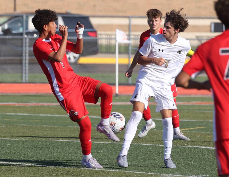 Yorkville's Izai Terrazas (left) and Sycamore's Noah Daykin try to win possession Thursday, Aug. 28, 2025, during their game in the Barb Cup tournament at DeKalb High School.