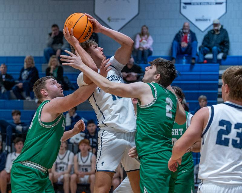 Kash Klendworth (10) of Fieldcrest pulls up for midrange shot over Dwight's defense on Monday, December 15, 2025 at Fieldcrest High School in Minonk.