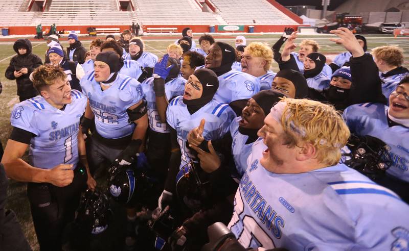 Members of the St. Francis football team react after winning the Class 5A State championship on Tuesday, Dec. 2, 2025 in Hancock Stadium at Illinois State University in Normal.