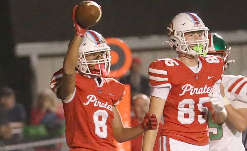 Ottawa's Bryson Valdez holds the ball in the air after making a catch with teammate Dane Carretto on Friday, Sept. 12, 2025 at King Field.