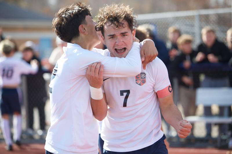 Conant's Danny Flores (12) and Krystian Niziolek (7) celebrates the victory over Geneva at the Class 3A St. Charles North Sectional Final on Saturday, Nov.2,2024 in St. Charles.