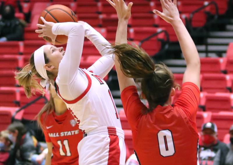 Northern Illinois Huskies guard Chelby Koker goes to the basket against Ball State Cardinals guard Ally Becki during their game Wednesday, Jan. 5, 2022, at Northern Illinois University in DeKalb.
