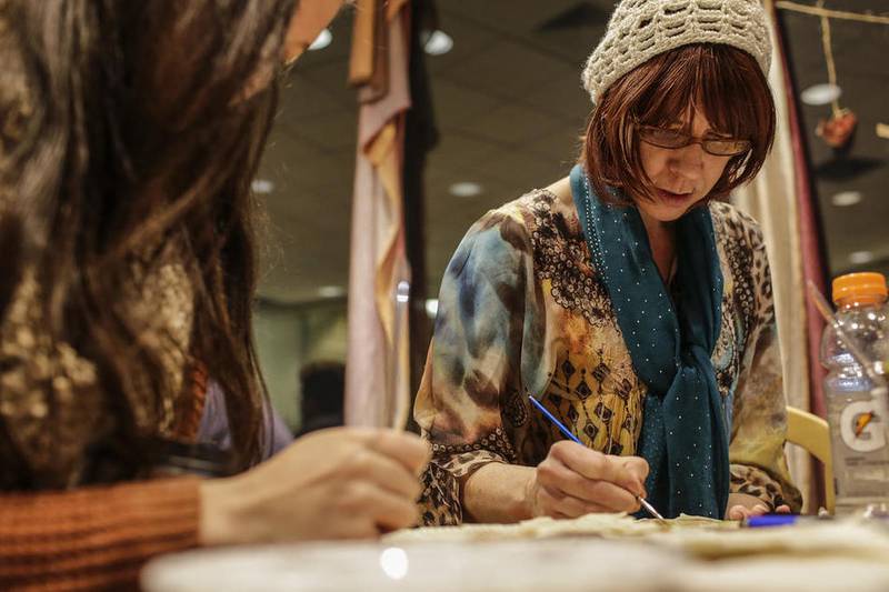 Book and Bean Cafe owner Tammy Duckworth paints Jan. 4, 2016, with watercolors during an art night at the cafe in Joliet.