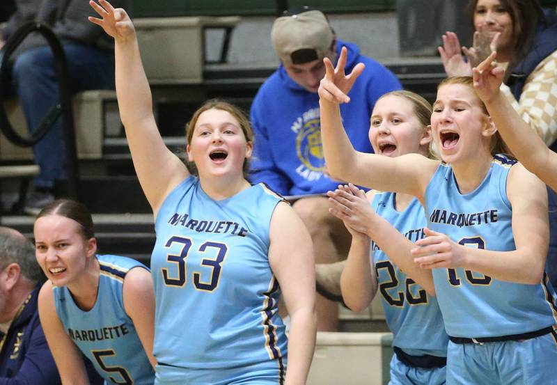 Marquette players (from left) Chloe Larson, Madison Kozlowski, Nevaeh Corcoran and Lucy McGrath react to a three-point basket against St. Bede on Monday, Dec. 2, 2024 at St. Bede Academy.