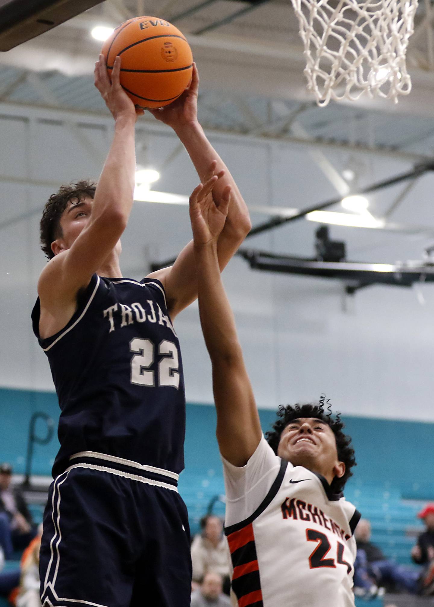 Cary-Grove's Adam Bauer catches a pass over McHenry's Adam Anwar during the Woodstock Hoops for Healing Tournament Championship game on Wednesday, Nov. 27, 2024, at Woodstock North High School.