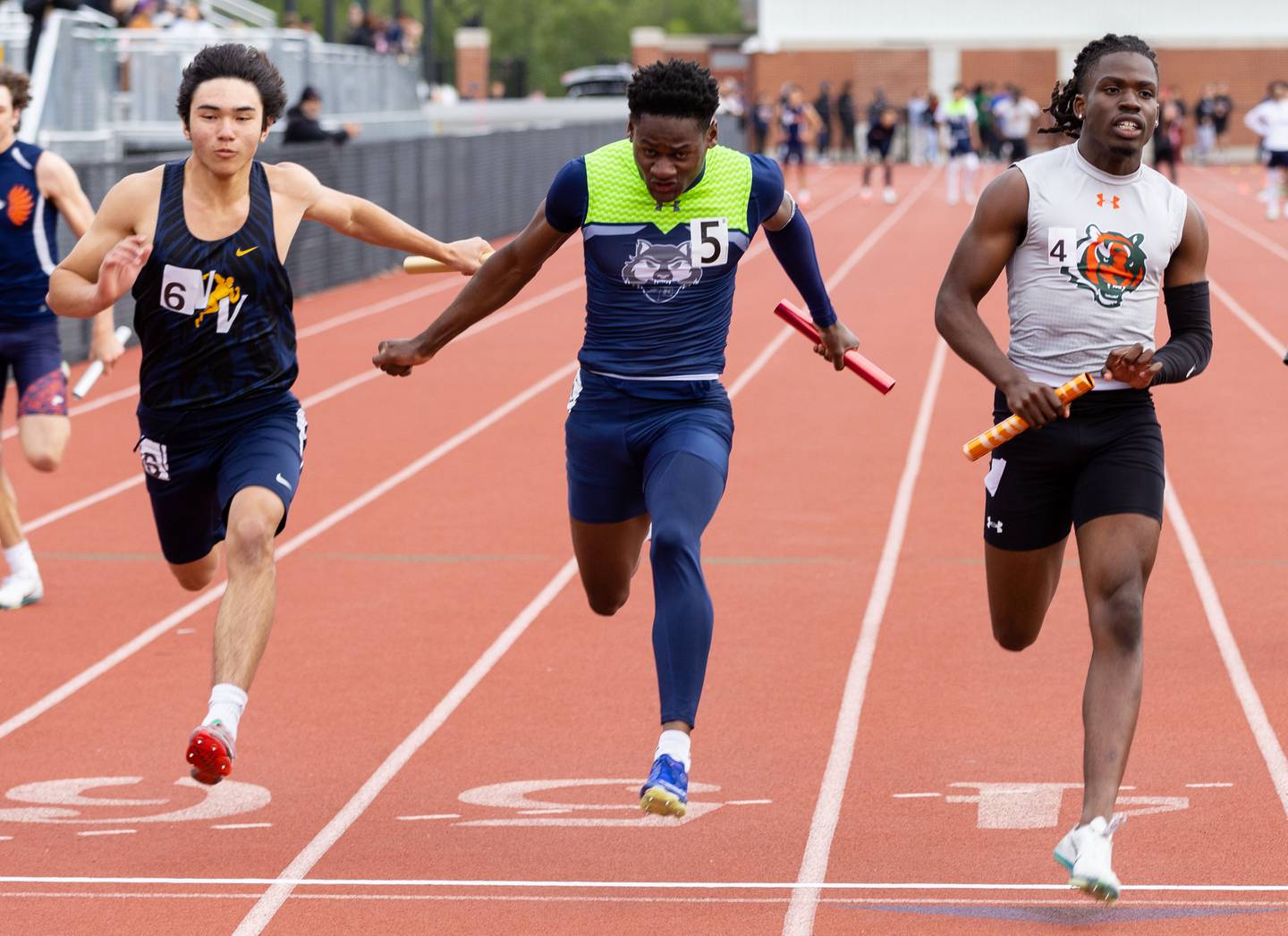 Plainfield East’s Joe Owusu, right edges out Oswego East’s Nigel Grisby, middle, and Nequa Valley’s Jacob Kucharz for the win during the Boys Track and Field Class 3A East Aurora Sectional hosted by East Aurora High School in Aurora on Thursday, May 22, 2025.