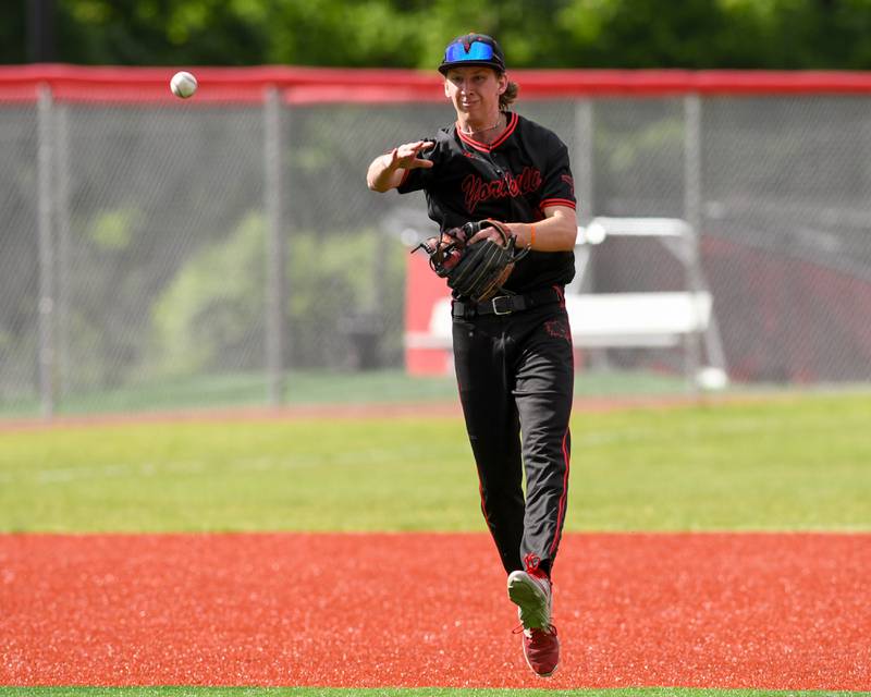 Yorkville's Kamden Muell (9) throws the ball to first base for an out while taking on Romeoville during the regional game held at Yorkville High School.