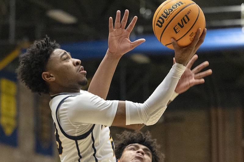 Sterling’s Kaedon Phillips swoops to the hoop against UT Tuesday, Jan. 14, 2025.
