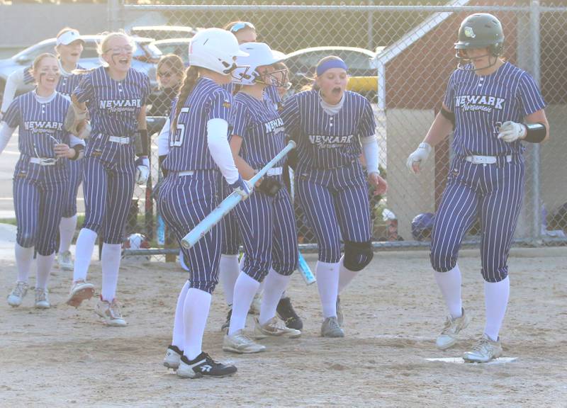 Newark's Riley Carlson (right) scores a run against Earlville during the Class 1A Regional final on Thursday, May 22, 2025 at Indian Creek High School in Shabbona.