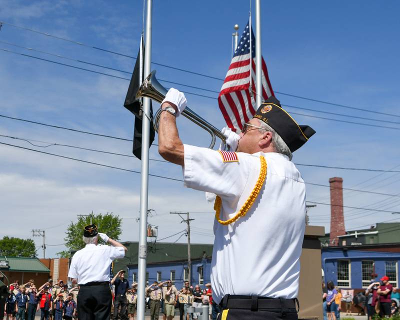 Plano bugler David Hulne plays taps during the Memorial Day remembrance ceremony held at Memorial Park in Plano on Monday, May 29, 2023.