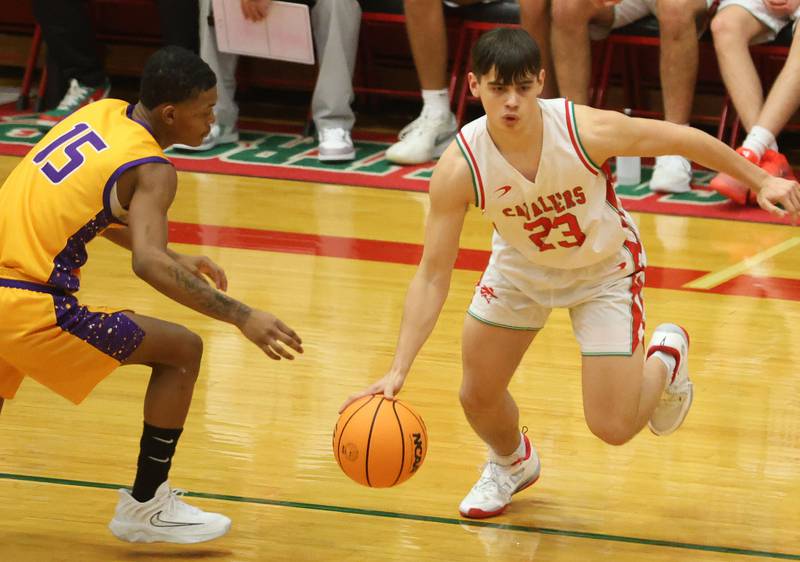 L-P's Jake Hall dribbles around Rantoul's Bryson Wallace on Friday, Dec. 19, 2025 in Sellett Gymnasium at L-P High School.