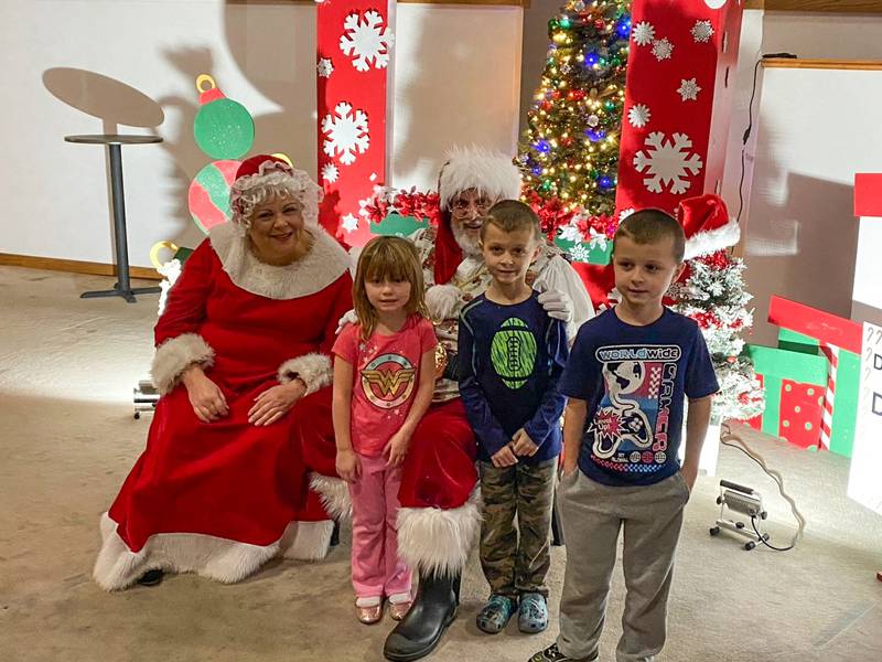 Santa and Mrs. Claus with Gunner, Adalynn, and Dillon.