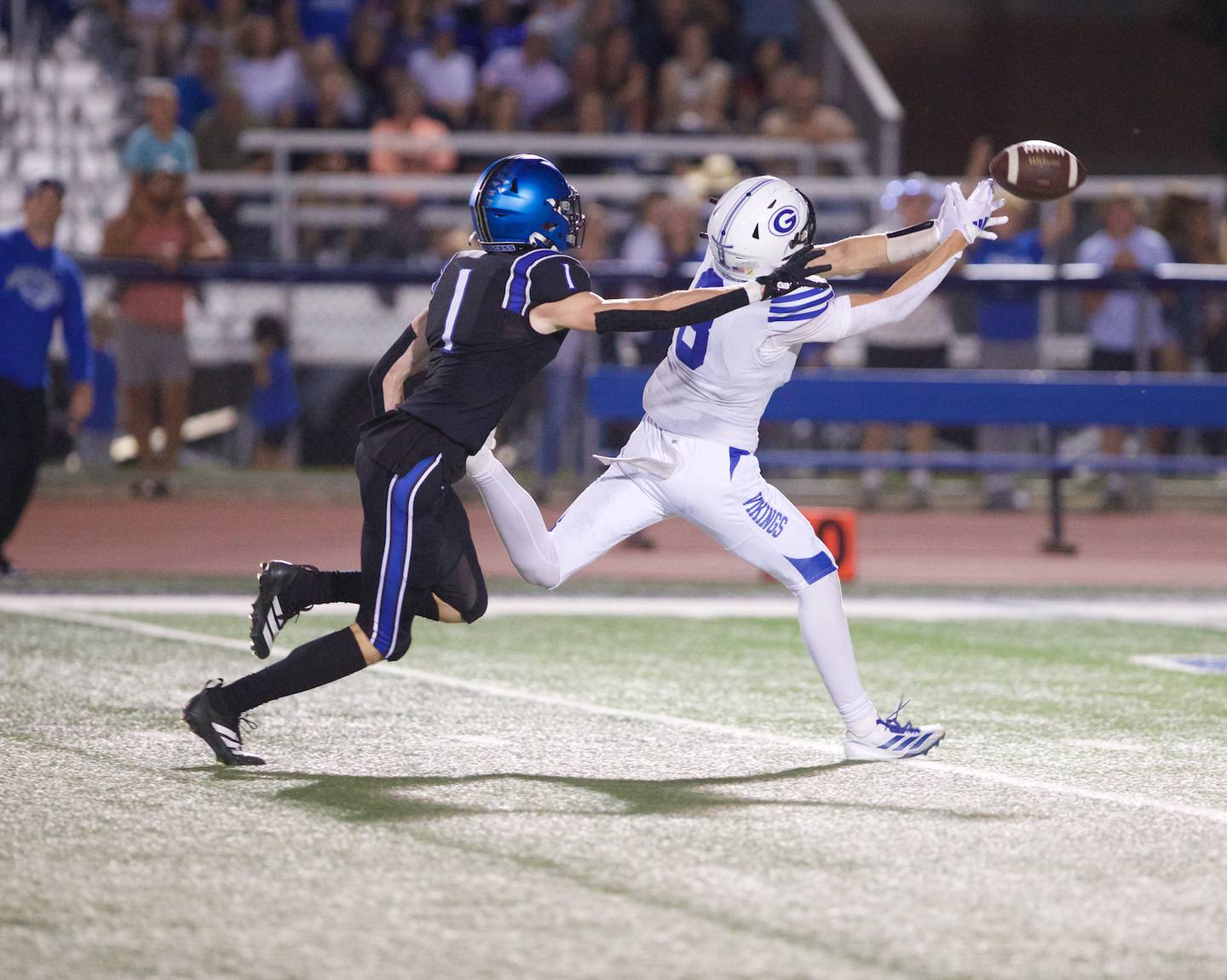 Geneva's Bennett Konkey is just shy of making the catch as pressured by St. Charles North's Reed Raczka on Sept. 12, 2025 in St. Charles.