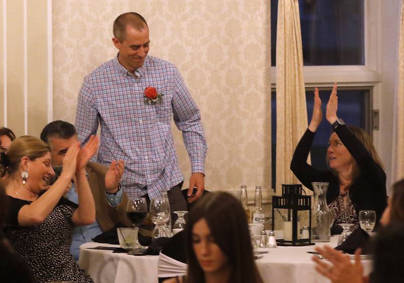 People clap for Richard Rohde of Heineman Middle School after he won the middle school award during the the Educator of the Year Dinner, Saturday, May 6, 2023, at Hickory Hall, in Crystal Lake. The annual awards recognize McHenry County’s top teachers, administrators and support staff.