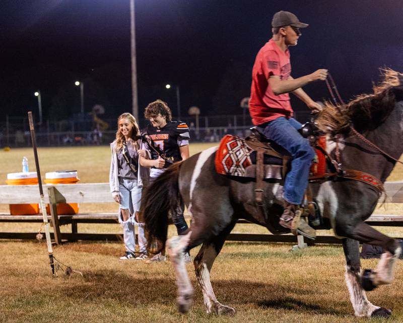 Sydney Wright and Leelynd Durbin have trident thrown in front of them by Rylan Knott as he rides Whisky (Horse) on Friday, Sept. 26, 2025, at Woodland School in rural Streator.