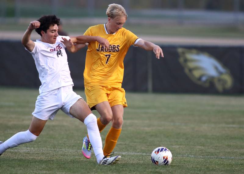 Jacobs’  Elijah McCloud, right, battles Prairie Ridge’s Conor D’Antonio in varsity soccer at Jacobs High School in Algonquin on Thursday, Sept. 18, 2025.